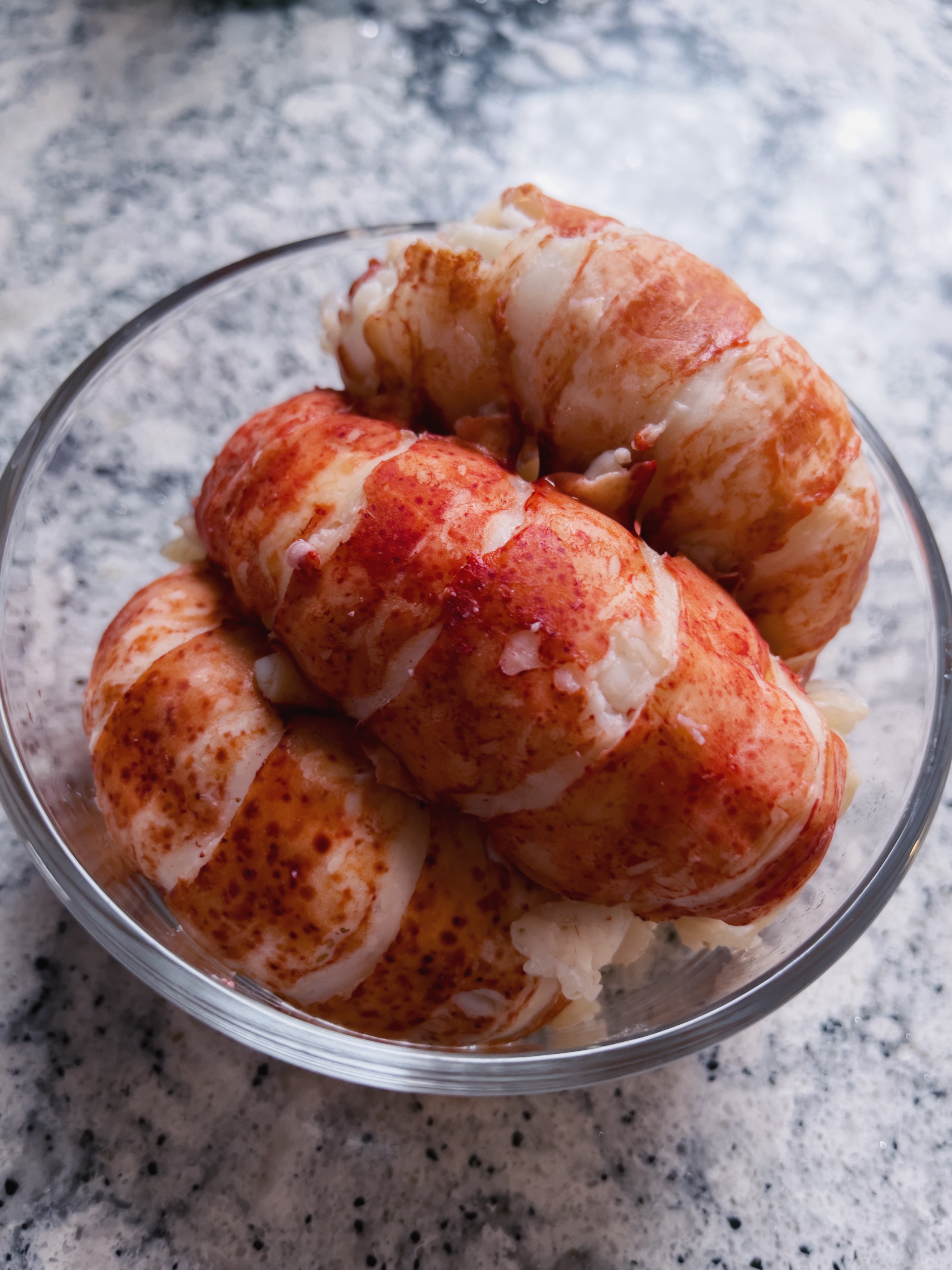 three cooked, whole lobster tails without shells