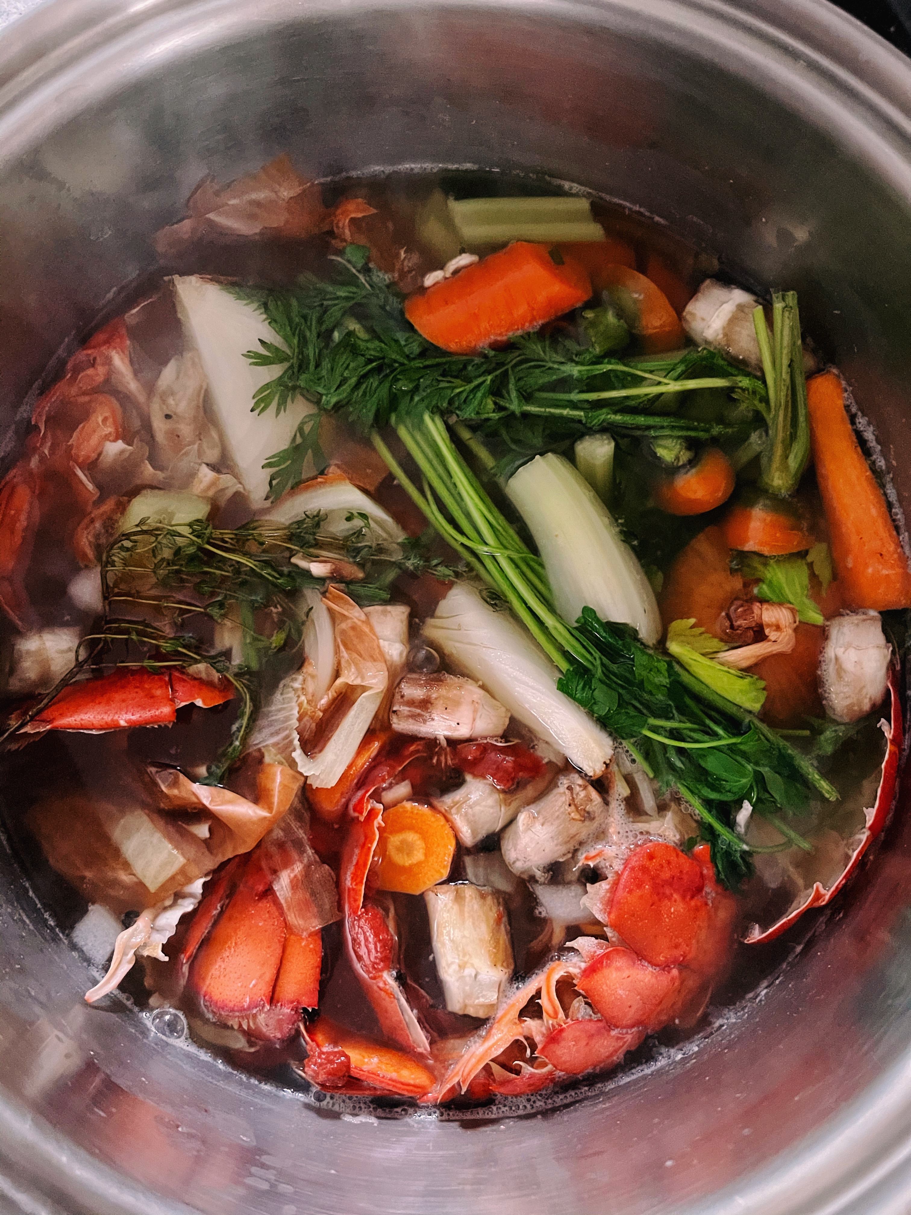 unstrained seafood stock in pot