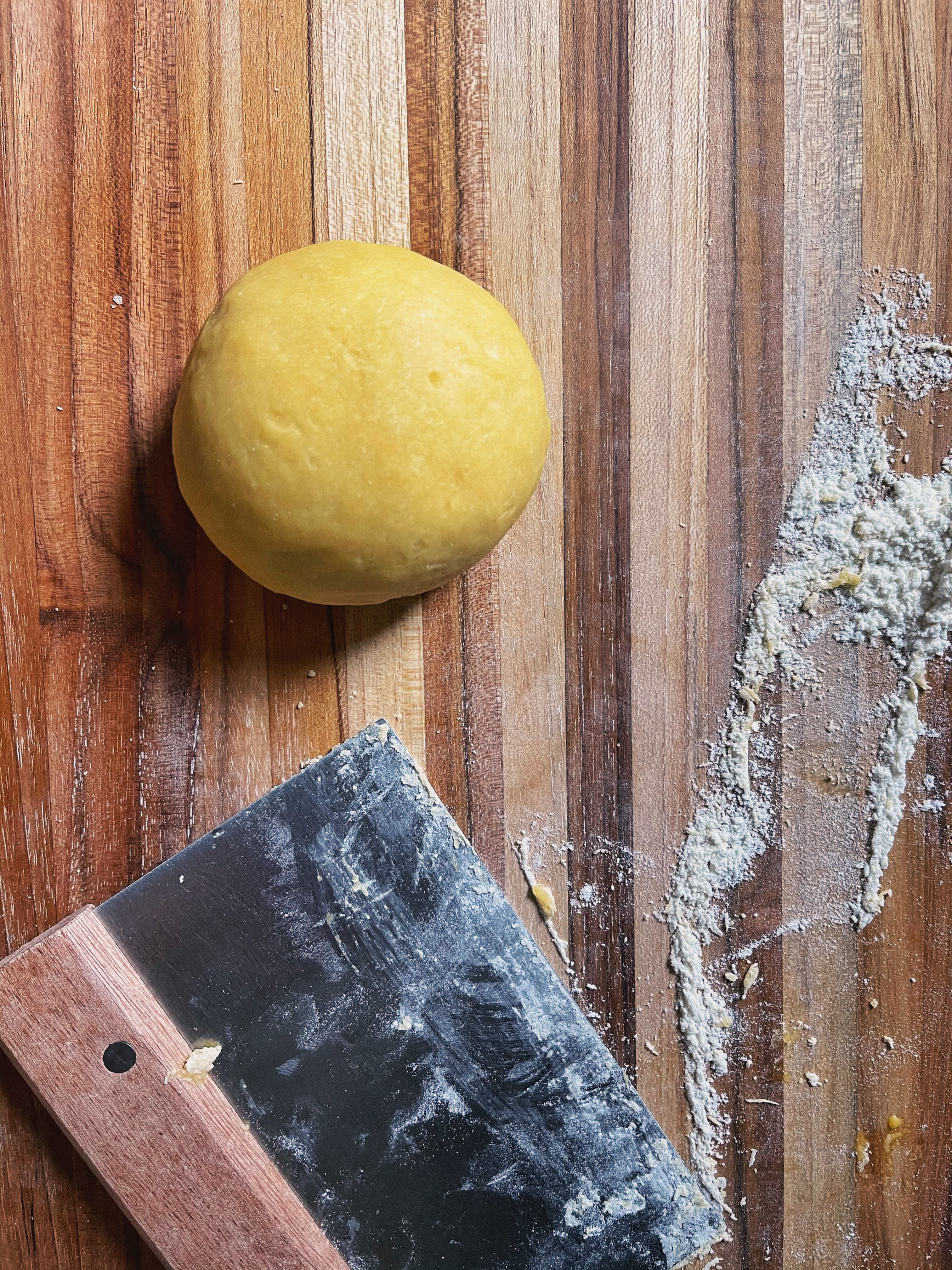 pasta dough on wooden board